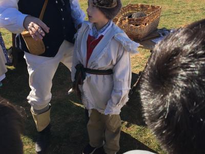 photo of students learning about colonial garb