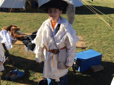 photo of student learning about colonial garb