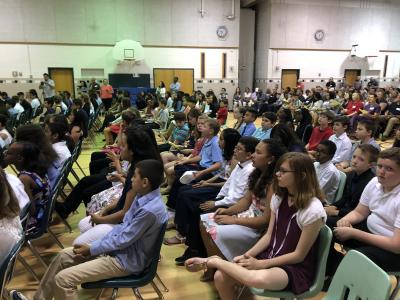 photo of sitting students in an audience
