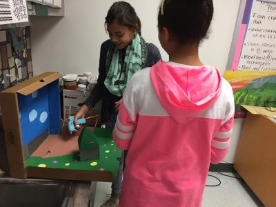 photo of two students working on mini claymation set