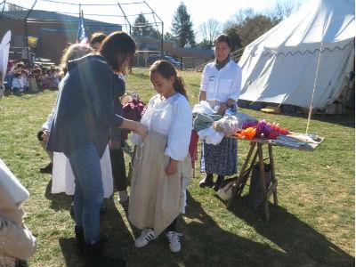 photo of students outside learning about colonial clothes