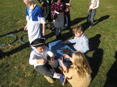 photo of students learning about colonial games