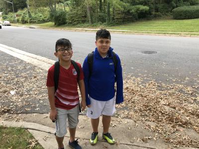 photo of two students walking to school