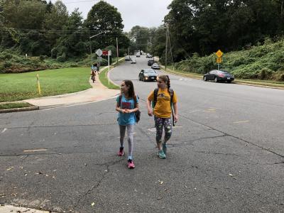 photo of two students walking to school