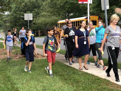 photo of students and teachers walking to school