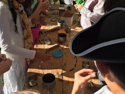 photo of students learning about colonial tools and creativity